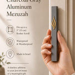 Modern charcoal gray and gold aluminum mezuzah with narrow rectangular architectural profile