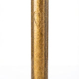 Gold glittery cylindrical object on a white background