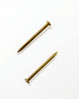 Gold mezuzah nails for mounting mezuzah cases to doorposts with a warm elegant hardware finish