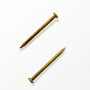 Gold mezuzah nails for mounting mezuzah cases to doorposts with a warm elegant hardware finish