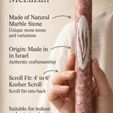 Hand holding a 7-inch Rose Veiled Shin natural marble mezuzah made in Israel with scroll-fit and doorway-use details