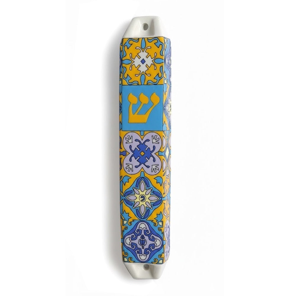 Ceramic Portugal mezuzah case with blue and yellow tile patterns and a Hebrew Shin letter.