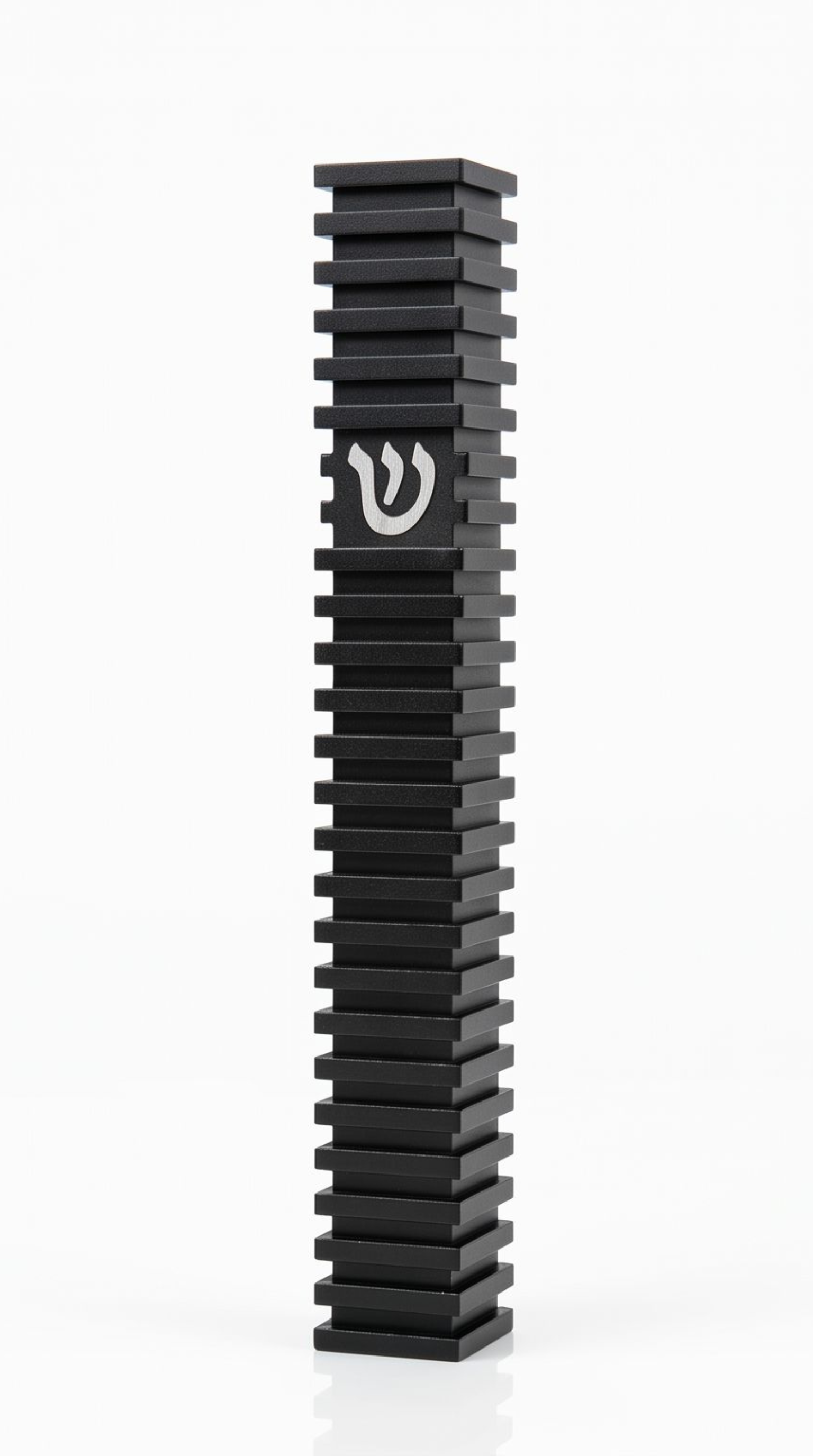 Modern Black Steps Aluminum Mezuzah, showing its deep black waterproof body, repeated raised horizontal steps, narrow rectangular profile, and centered silver Hebrew Shin