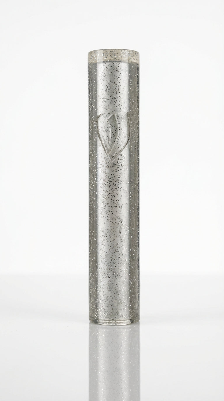 Silver shimmer acrylic mezuzah case with a carved Hebrew letter Shin on a white background.