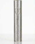 Silver shimmer acrylic mezuzah case with a carved Hebrew letter Shin on a white background.