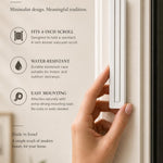 Person holding the white pyramid mezuzah at realistic scale, styled with warm natural light and neutral tones for a premium look.