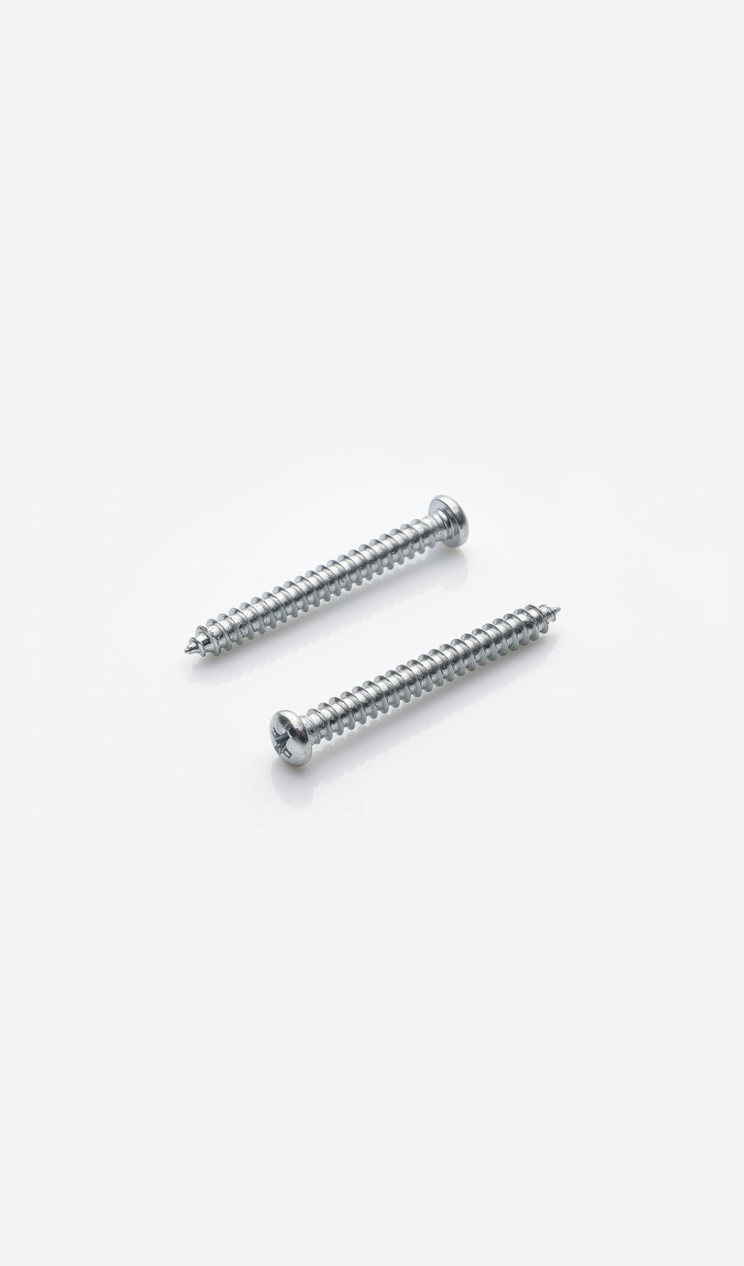 Silver mezuzah screws with threaded grooves for secure mounting of heavier mezuzah cases to indoor and outdoor doorposts