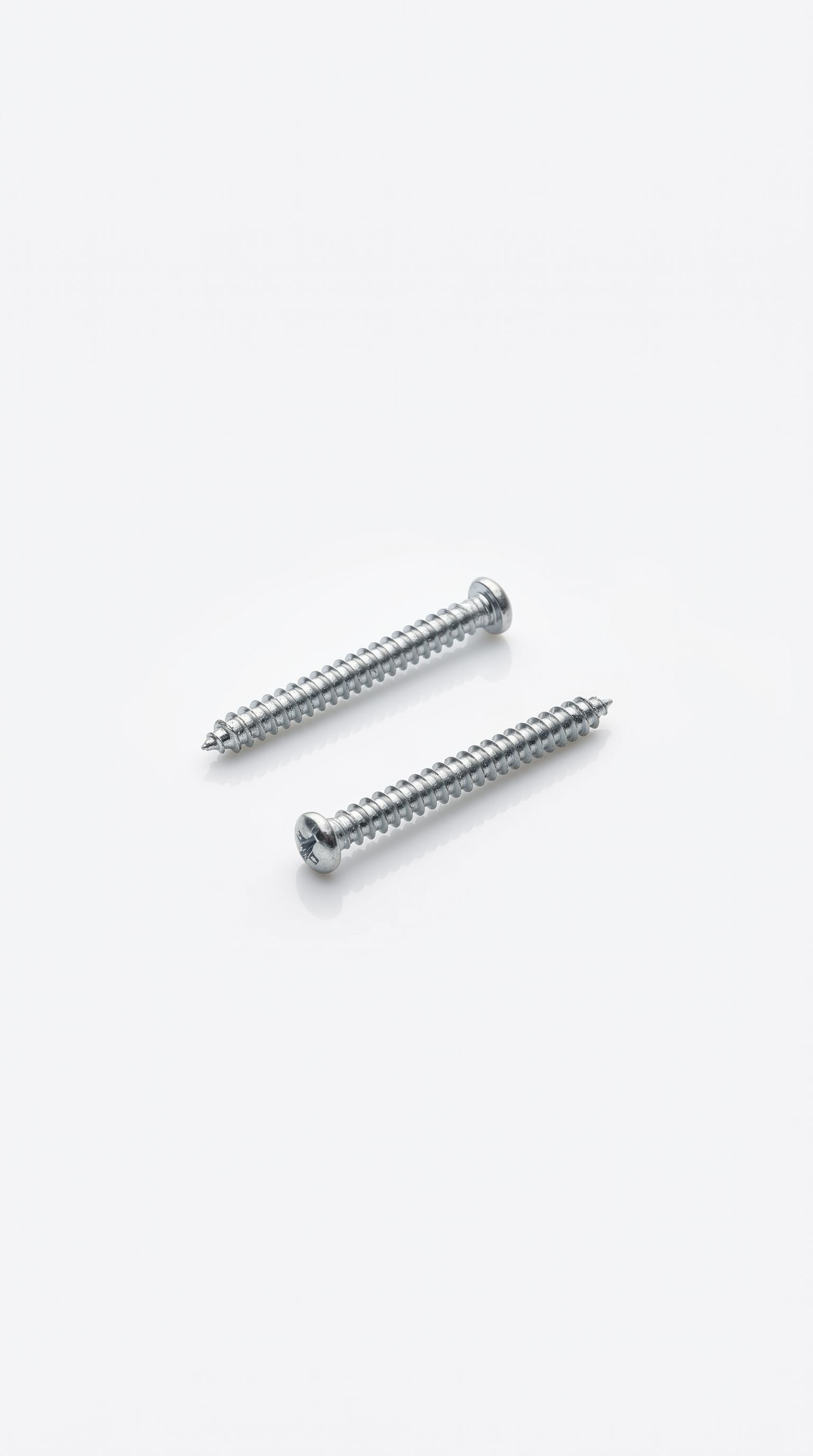 Silver mezuzah screws with threaded grooves for secure mounting of heavier mezuzah cases to indoor and outdoor doorposts