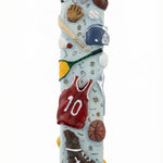 Decorative mezuzah case with sports-themed figurines on a white background