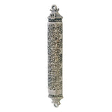 Decorative silver mezuzah case with geometric design on a white background