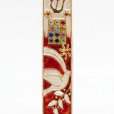 Red enamel mezuzah case with a white dove, gold Shin letter, and twelve colorful jeweled accents.