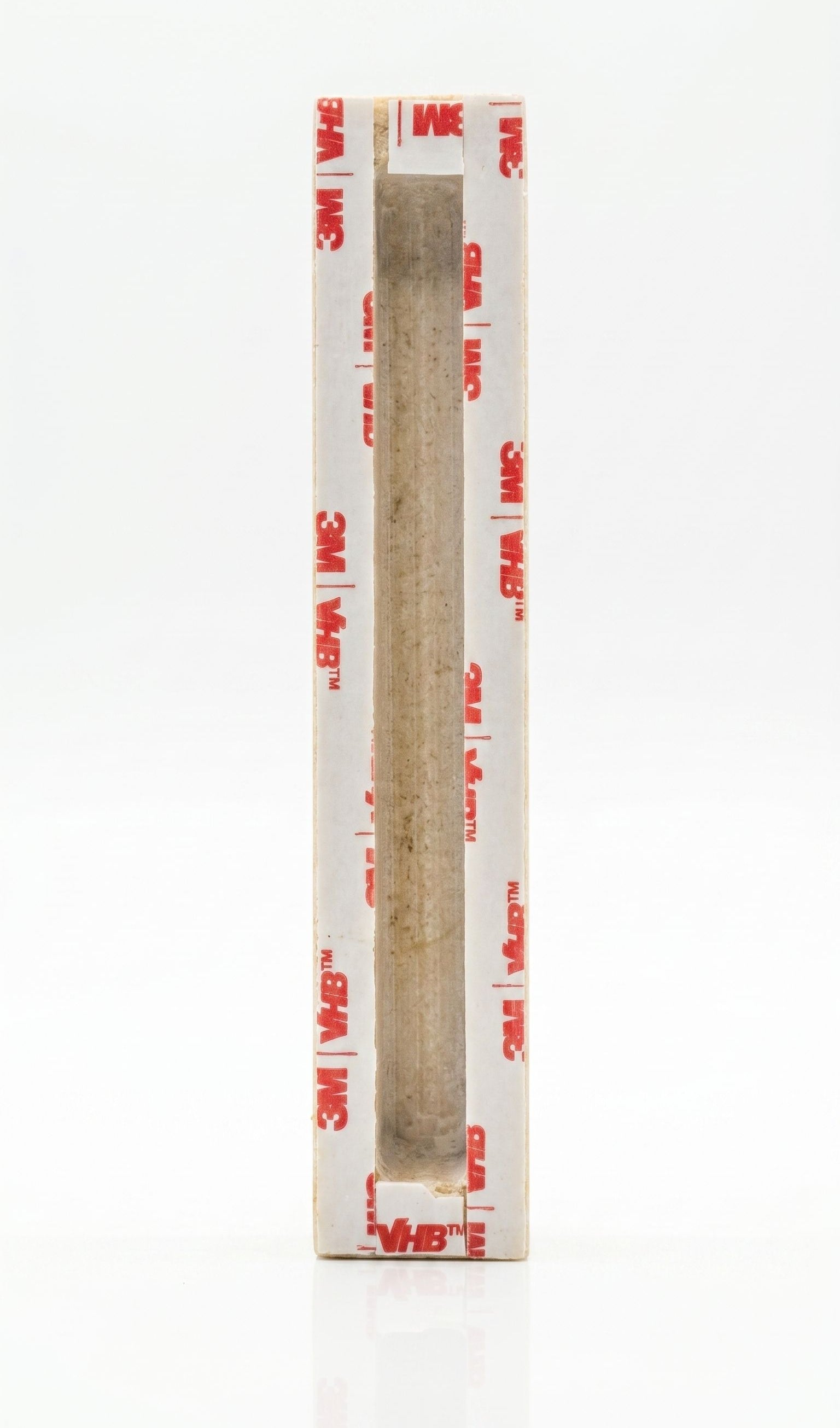 Back of Ana B’Koach Jerusalem stone mezuzah showing recessed scroll chamber and included mounting tape