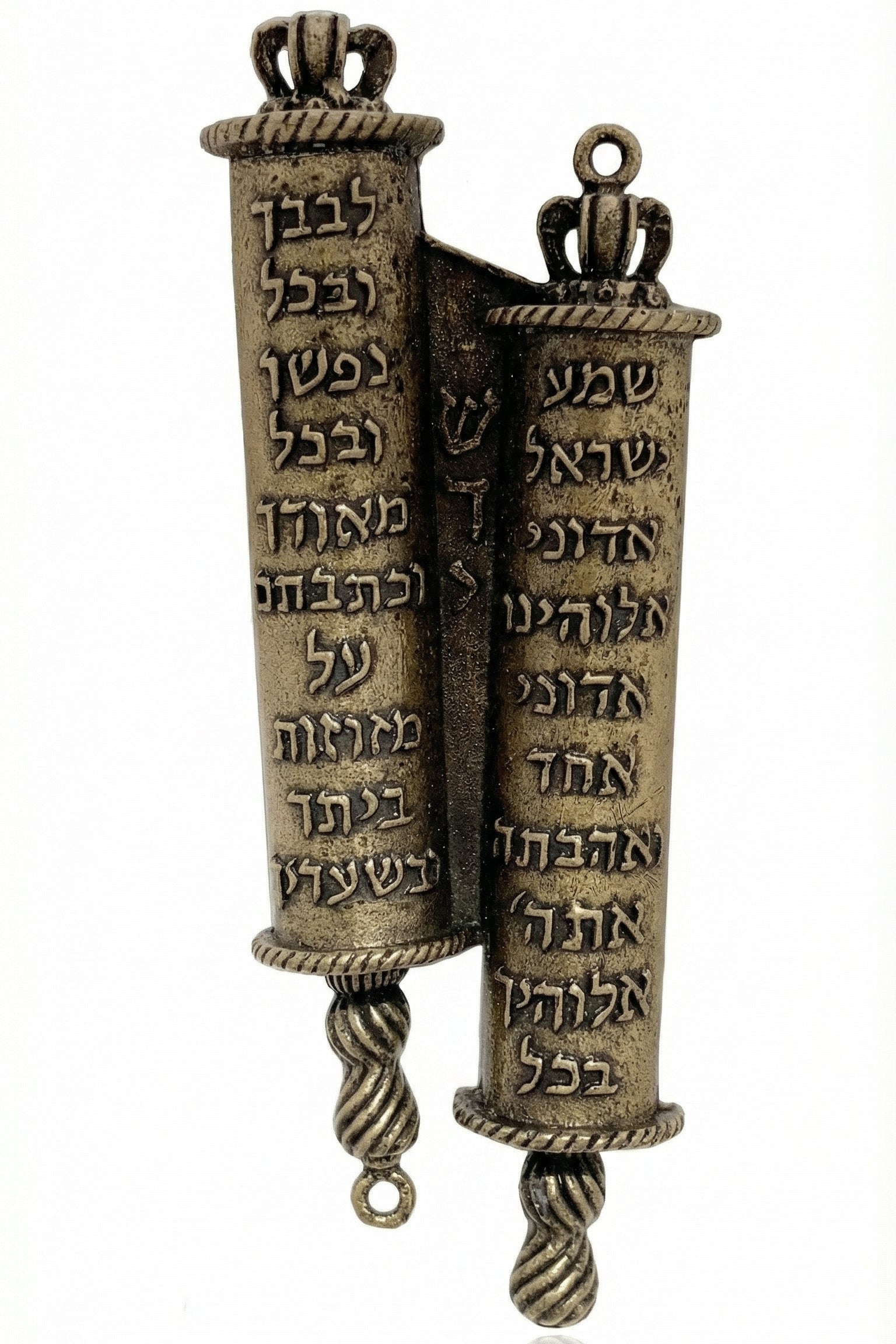 Crown-topped brass mezuzah case inspired by twin Torah scrolls, detailed Hebrew script, regal crown finials, on a white studio surface.