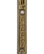 A detailed high-resolution image of an Ariel Brass Mezuzah with engraved Hebrew letters and decorative motifs, set against a pure white background with a soft reflection.