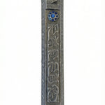 A finely detailed Pewter Mezuzah, 6.25 inches tall, made in USA, with Hebrew inscriptions and decorative motifs, on a white studio background.