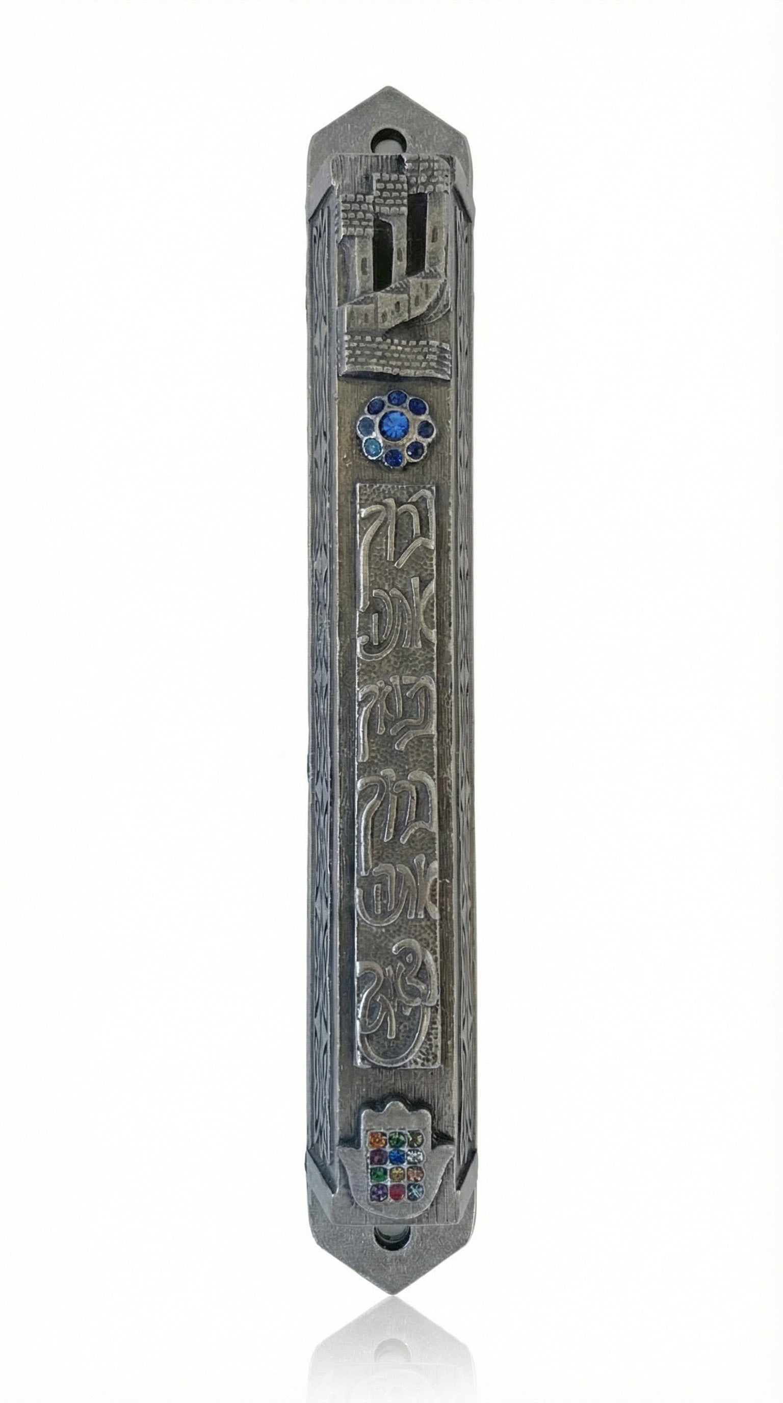 A finely detailed Pewter Mezuzah, 6.25 inches tall, made in USA, with Hebrew inscriptions and decorative motifs, on a white studio background.