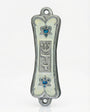 Front view of Pearlescent Kotel Heart white pewter mezuzah with hand-painted enamel, raised Shin and blue heart-shaped Stars of David