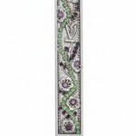 Petite floral Mezuzah with jewel-toned embellishments on a metal base, measuring 3.4 inches tall, displayed on a clean white studio surface with a soft reflection.