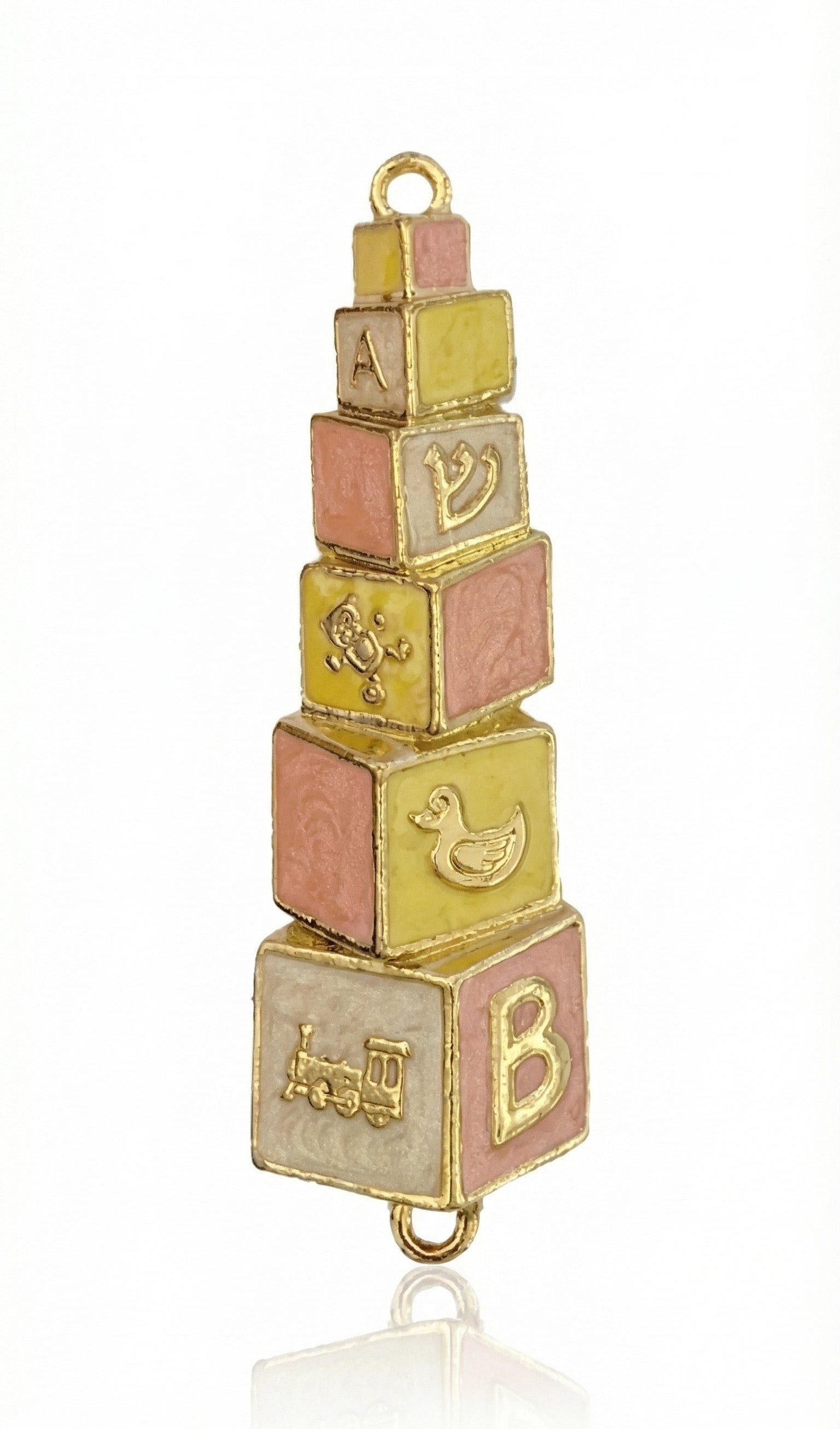 Hand-painted brass baby mezuzah in pink and yellow, 4 inches tall with Hebrew inscription, designed for nursery decor, with a bright white background.