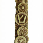 Brass Bar Kochva coin mezuzah with detailed engraved Hebrew letters and archaeological inscription, displayed on a white studio background with subtle reflection.