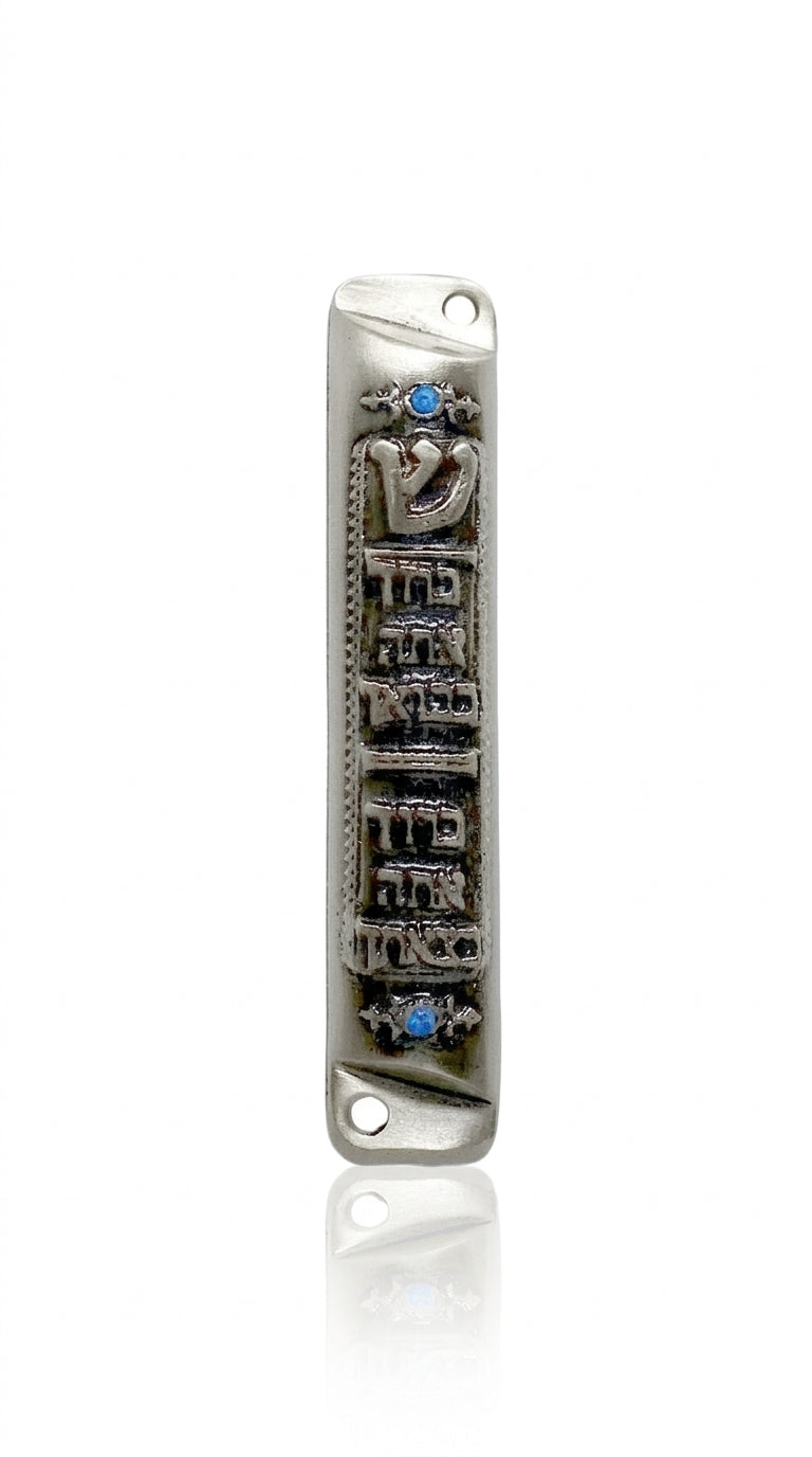 Elegant Pewter Birchat Habayit Mezuzah with blue accents and Hebrew blessing for home, displayed on a white background with soft reflection.