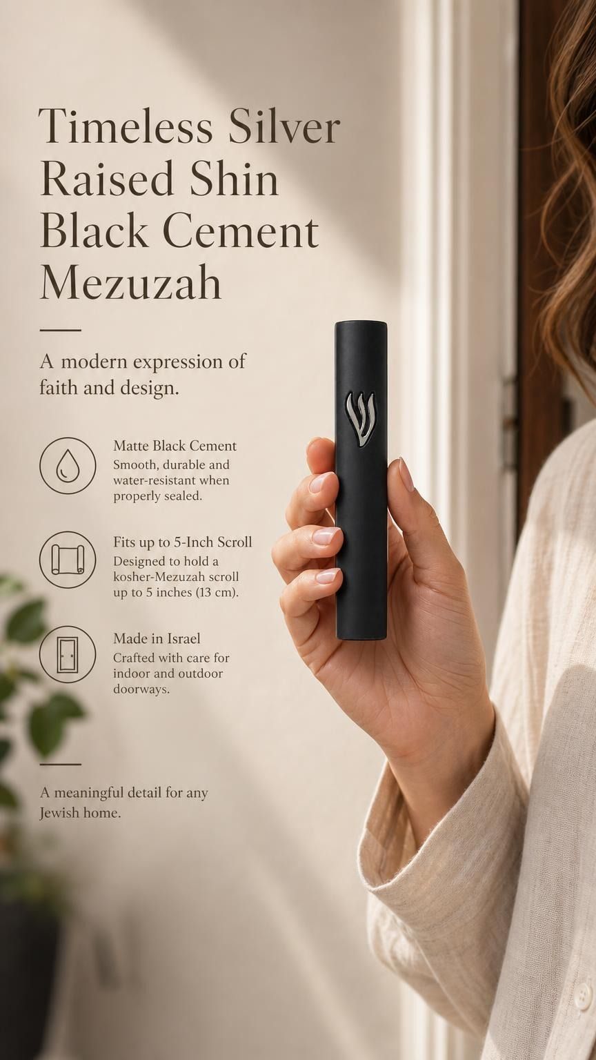 Handheld modern black cement mezuzah case with a raised sculptural silver-tone Shin, shown beside product details to demonstrate the slim profile, matte cement finish, minimalist design