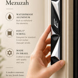 Futuristic Cyber Prism Black Geometric Mezuzah with silver facets and Hebrew Shin on a doorpost.