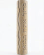 High-resolution image of handcrafted Mezuzah made of Jerusalem stone, engraved Hebrew blessing, on a white studio background with soft reflection.