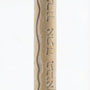 High-resolution image of handcrafted Mezuzah made of Jerusalem stone, engraved Hebrew blessing, on a white studio background with soft reflection.