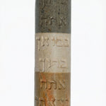 Handmade Israeli stone Mezuzah with Hebrew blessing, engraved with Jerusalem and Hebron scenery, on a white studio background with soft reflection.