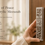 Person holding Blessings of Peace Silver Acrylic Mezuzah displaying its Hebrew blessing and decorative details