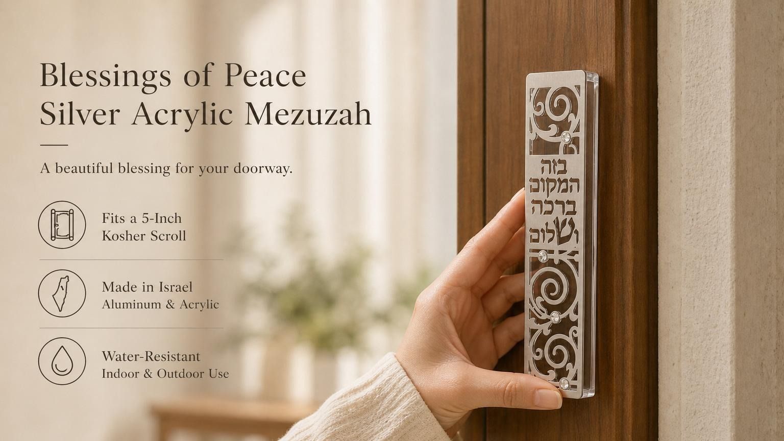 Person holding Blessings of Peace Silver Acrylic Mezuzah displaying its Hebrew blessing and decorative details