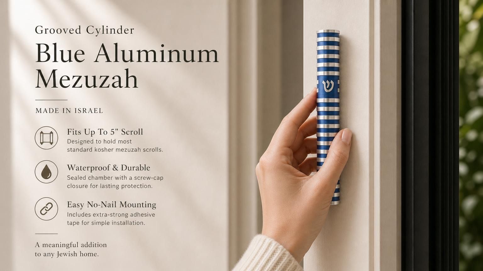 Person holding a blue aluminum mezuzah with silver Shin and grooved round design, in a premium editorial style for a store feature.
