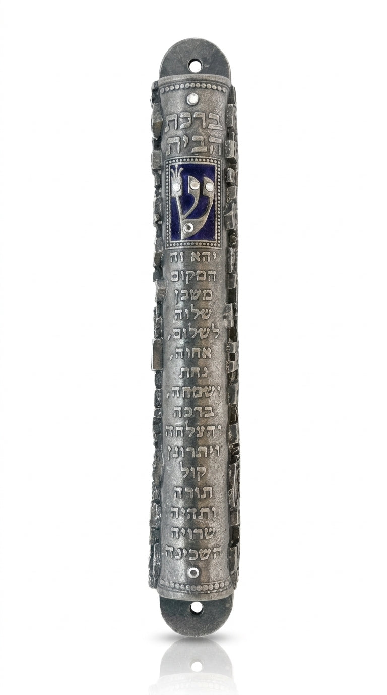 Ornate blue mezuzah for home with Hebrew engravings and decorative motifs, made of pewter, with a white studio background and subtle reflection.