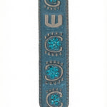 Upscale image of a 4-inch tall Blue Sky Mezuzah with detailed engraving and Hebrew letters on a bright white background with soft reflection.