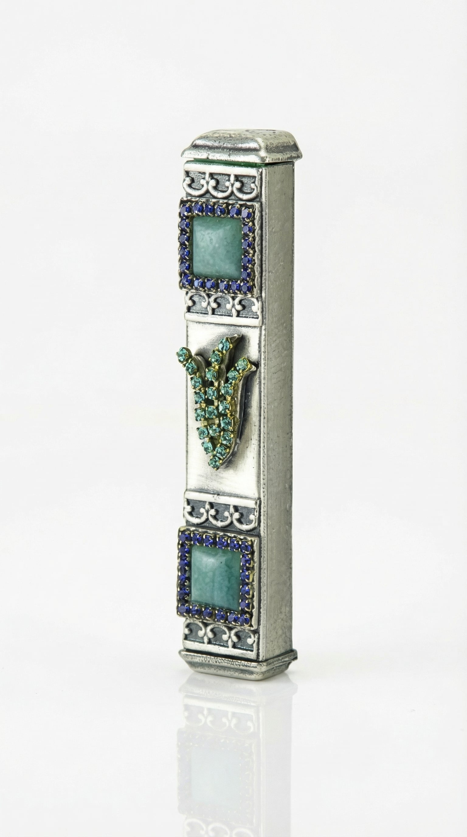Petite blue stone mezuzah with Hebrew shin and sparkling accents showcasing detailed craftsmanship