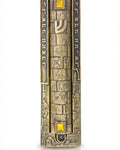 Large brass mezuzah featuring Jerusalem cityscape and decorative sunrise stones, perfect for front door, with detailed engravings and Hebrew text.
