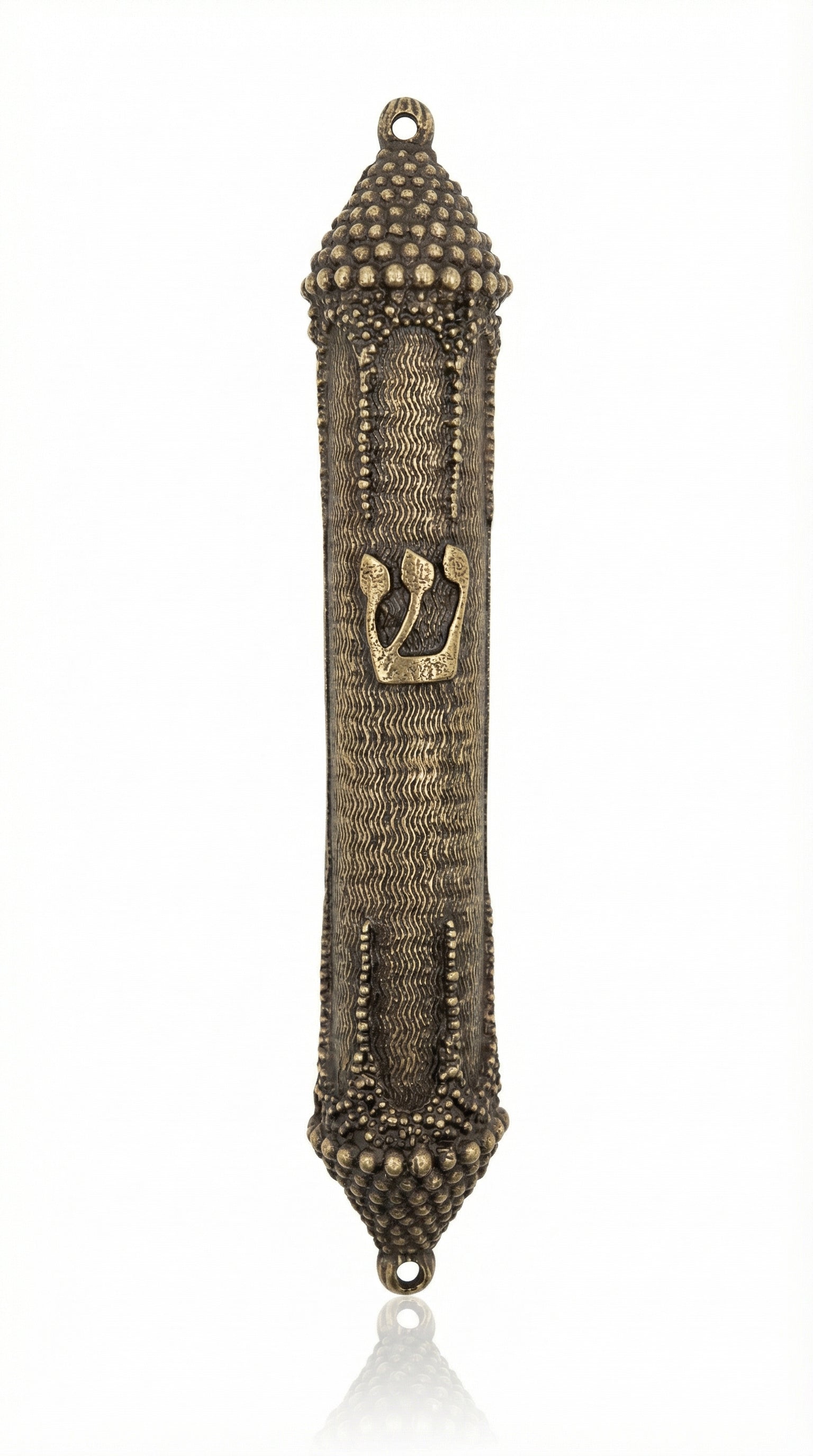 Elegant brass mezuzah with antique finish, 5.5 inches tall, featuring detailed Hebrew engravings and decorative motifs on a white studio background.