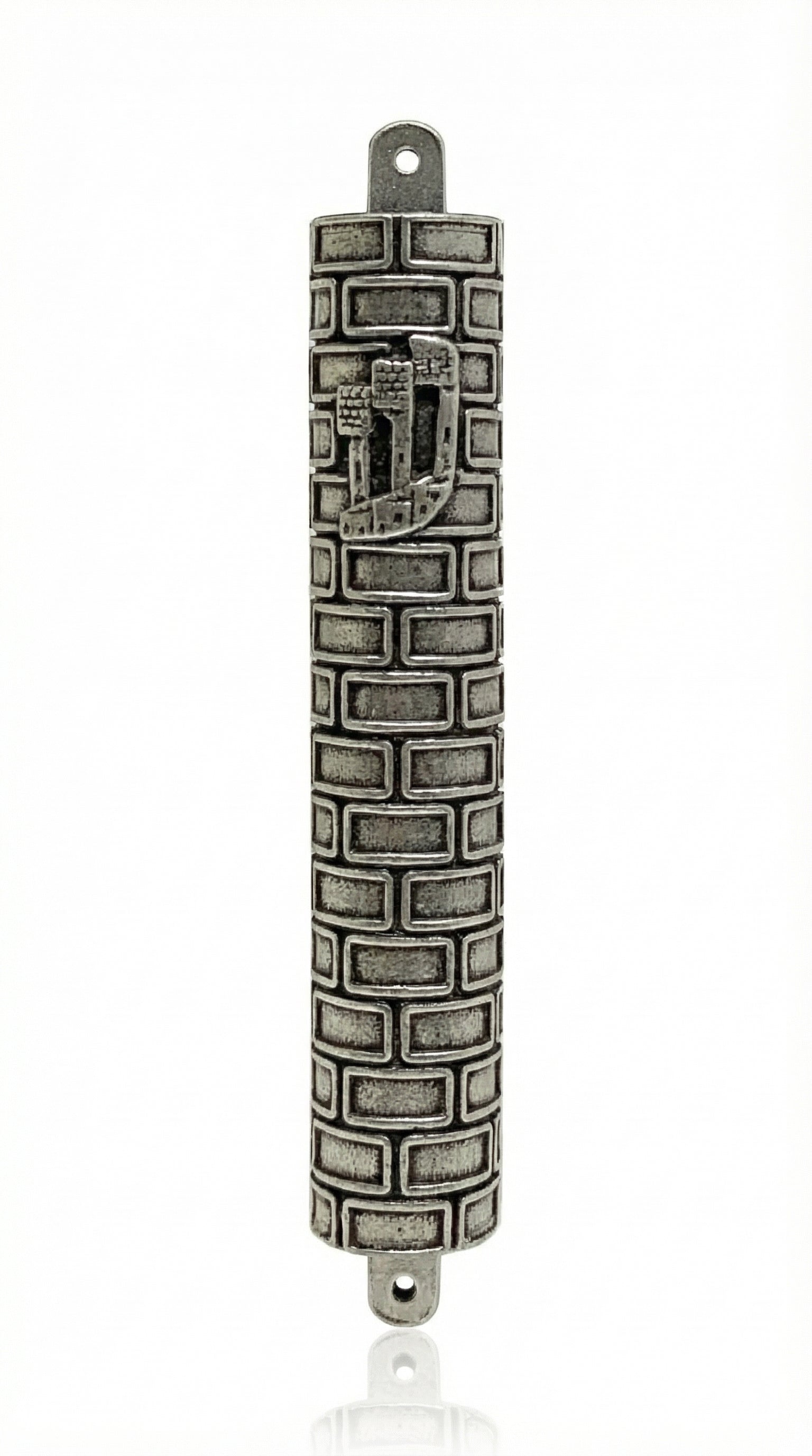 High-resolution image of a Pewter Bricks Mezuzah, 5 inches tall, with detailed engraved Hebrew letters, decorative motifs, and a polished finish, on a pure white background with a subtle reflection.