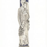 High-quality image of a hand-painted pewter Mezuzah depicting a bride and groom, with detailed craftsmanship and a white studio background.