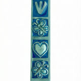 Decorative blue butterfly mezuzah made of pewter with enamel accents, featuring floral and butterfly motifs, ideal for home doorways.