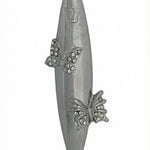 Upscale high-resolution image of a detailed butterfly-themed mezuzah made of pewter, mounted vertically on a white studio background with a soft reflection.