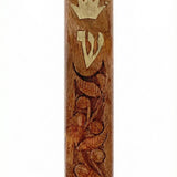 Carved wooden mezuzah made in Israel, 4.5 inches tall, with detailed engraved Hebrew letters, decorative motifs, and a polished finish.