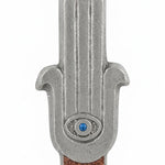 High-resolution image of a celestial Hamsa-shaped mezuzah with symbolic eye, accented with silver, turquoise, and brown sparkling paint, on a white background.