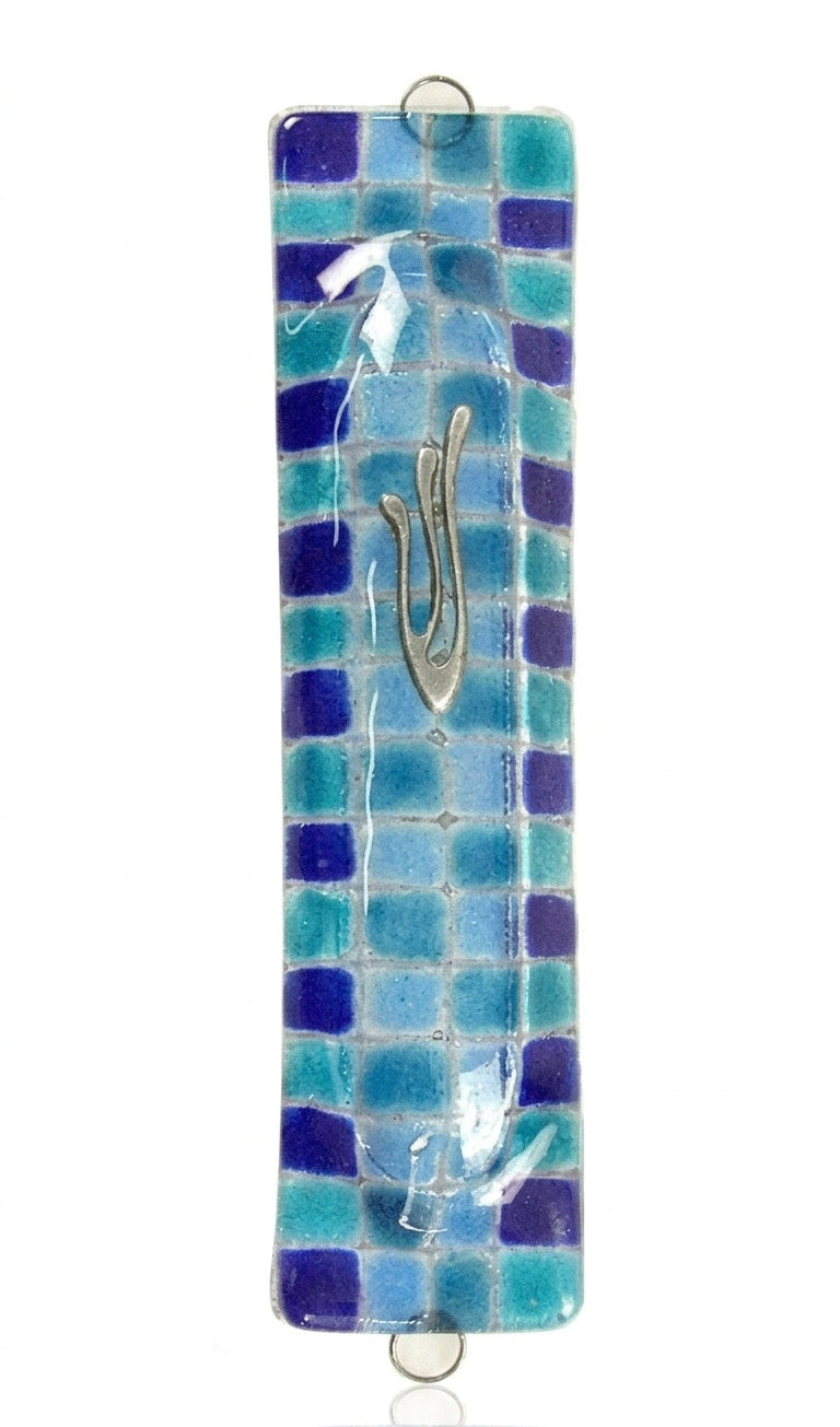 Contemporary fused-glass checkerboard Mezuzah with Hebrew symbols, mounted on a clean white background with soft reflection.
