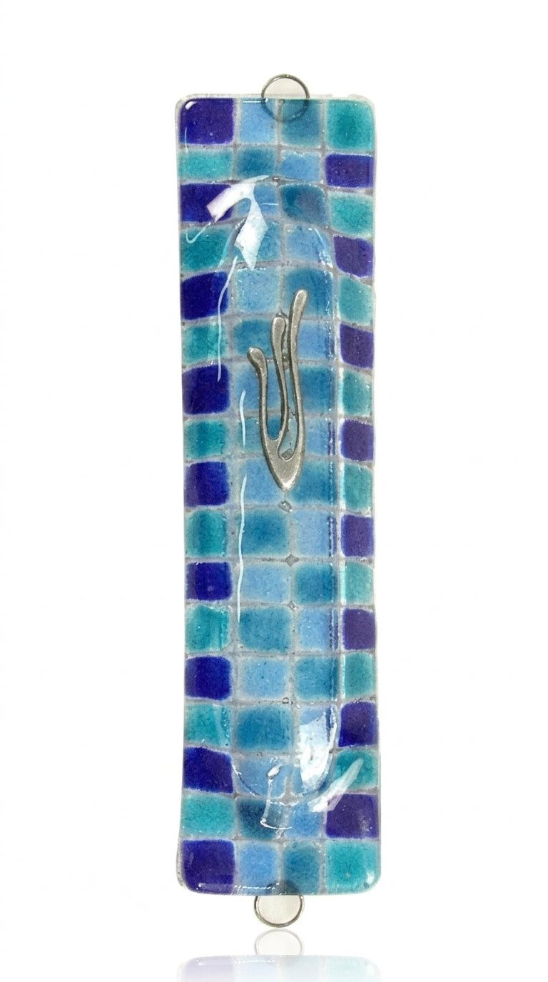 Contemporary fused-glass checkerboard Mezuzah with Hebrew symbols, mounted on a clean white background with soft reflection.