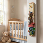 Children's nursery doorway adorned with a teddy bear mezuzah case, crafted in Israel, featuring a friendly bear design and textured finish.