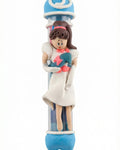 Handmade Cinderella Mezuzah crafted from fimo with protective glass tube, ideal for children's rooms, in bright studio setting with soft reflection.