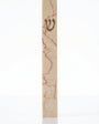 Rose Vein Jerusalem stone mezuzah case on a white background, showing a slim cream natural-stone body, rose-red mineral veining, and a raised gold Hebrew Shin