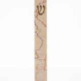 Rose Vein Jerusalem stone mezuzah case on a white background, showing a slim cream natural-stone body, rose-red mineral veining, and a raised gold Hebrew Shin